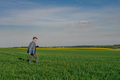 Modern Farmer Researcher Using Digital Tablet at Agricultural Field - PhotoDune Item for Sale