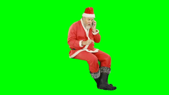 Santa claus talking on mobile phone