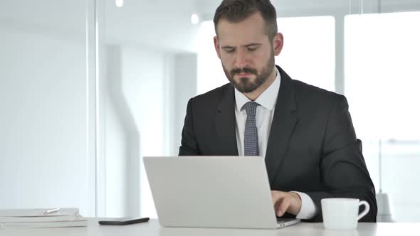 Shocked Middle Aged Businessman Working on Laptop Astonished