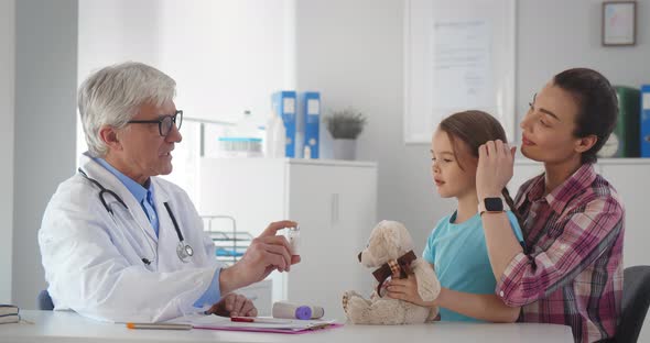 Little Girl Having Medical Examination By Pediatrician