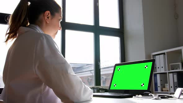 Doctor with Laptop Having Video Call at Hospital