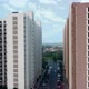 Drone approaching towards buildings in India on a sunny day - VideoHive Item for Sale