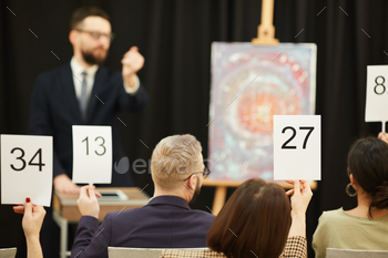 uying a painting during the auction