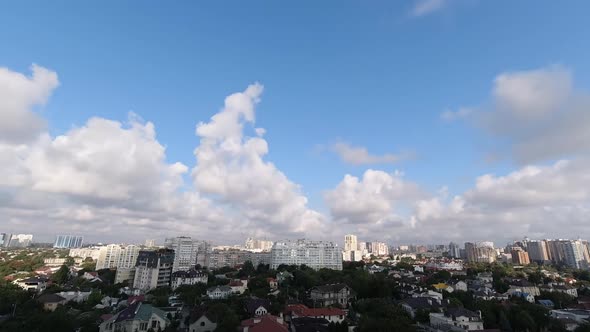 Timelapse with White Clouds Flying Fast Over the City on a Sunny Bright Summer Day. Ukraine, Odessa 