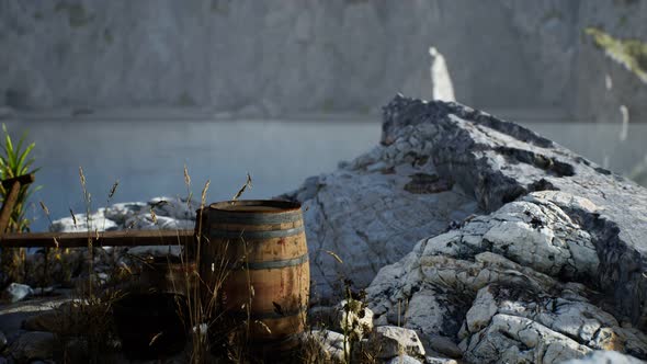 Wooden Barrels with Sea Fish at the Sand Beach