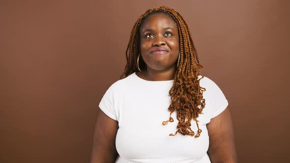 Cheerful African American Woman Showing Bellissimo Gesture Symbol of Approval Brown Studio