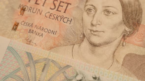 Lot of paper Czechia  crown banknotes slow tilt 4K 2160p 30fps UltraHD footage - Close-up of Czech R