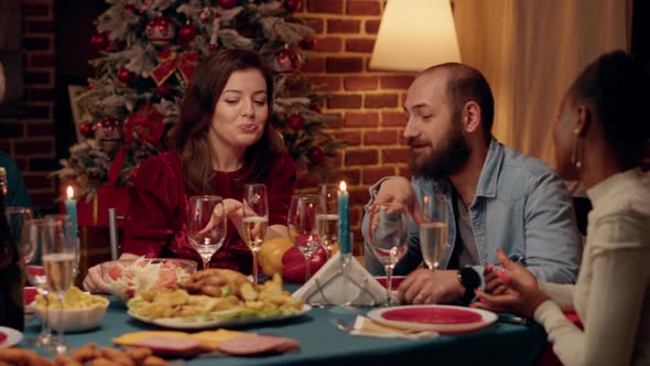 Joyful Wife and Husband Talking at Home While Enjoying Christmas Dinner