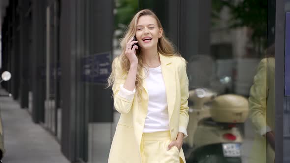 Smiling Woman Talking on Smartphone