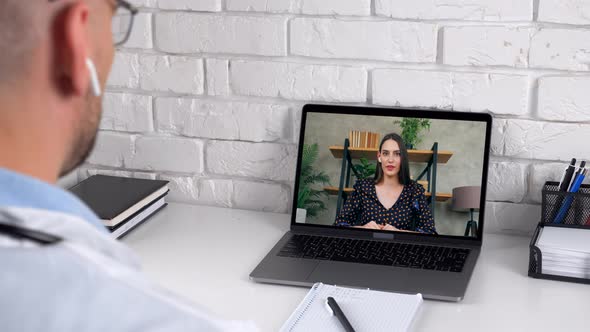 Woman in laptop screen communicates talk speak medical worker remote webcam