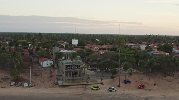 Drone crane motion reveal Guriu village from small hotel resort in sunset