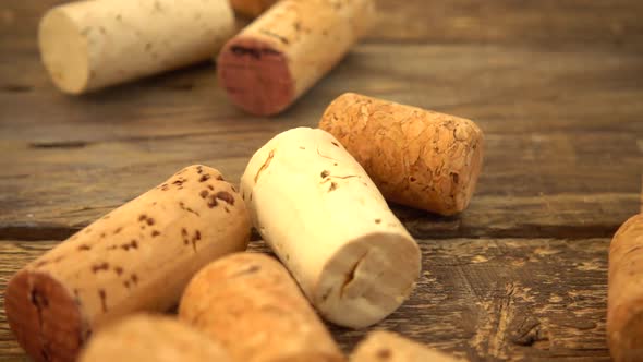 Falling wine corks on old wooden vintage boards. Slow motion.