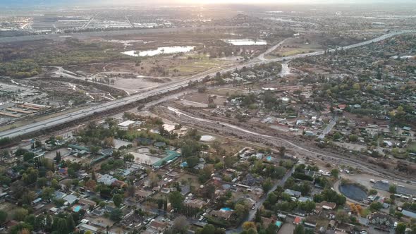 Drone getting aerial footage of the 210 freeway at Wheatland in lake view terrace, California and th