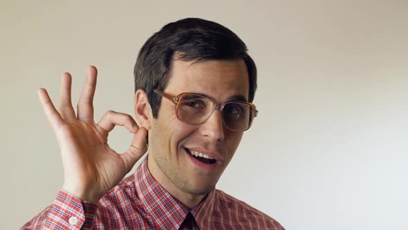 Smiling Man in Glasses Show Ok Sign