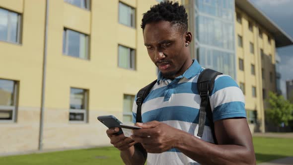 Student Male Buying and Paying in Internet on Mobile Phone