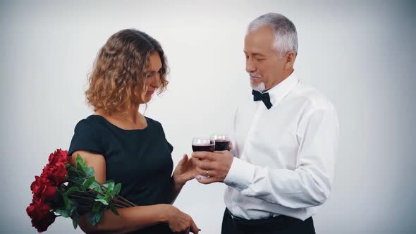 Happy Beautiful Middleaged Married Couple Celebrating Valentine's Day on a White Background