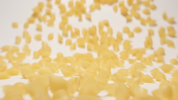 Stream Of Conchiglie Pasta Moving To A Camera