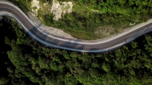 Aerial View Of The Mountain Road Between Green Trees