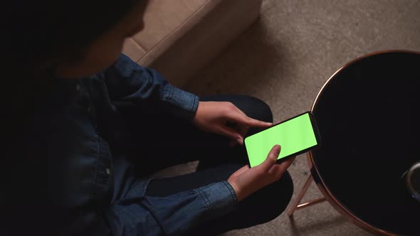 Closeup of woman holding smartphone