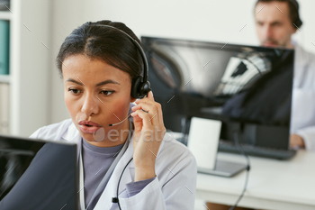  she answering on phone calls in medical call centre