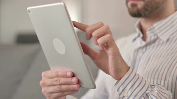 Close Up of Hands of Young Man Using Tablet 