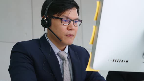 Business People Wearing Headset Working in Office