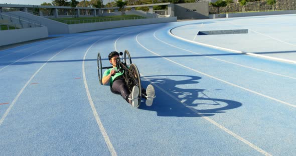 Disabled athlete racing in wheelchair 4k