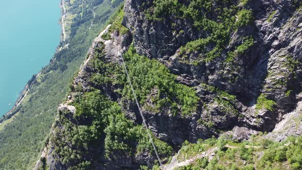 Extreme Via Ferrata suspension bridge over gorge at mountain Hoven in Loen - Norway