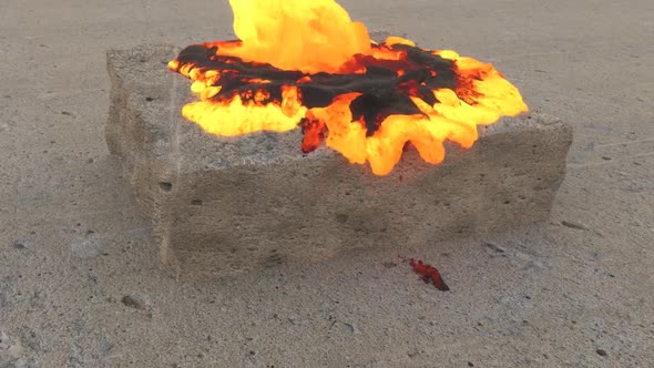 Flowing Lava From The Top To The Bottom On The Stone Surface