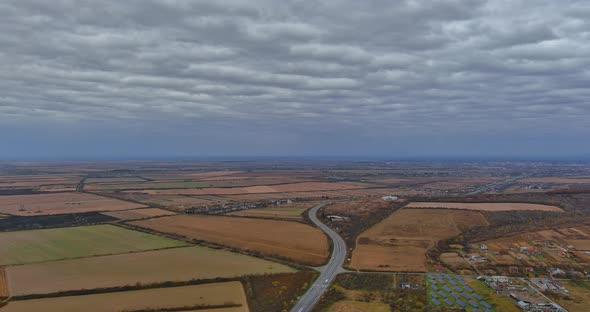 Aerial Top View Drive Autumn Road in the Valley Near Land From a Height Mountains