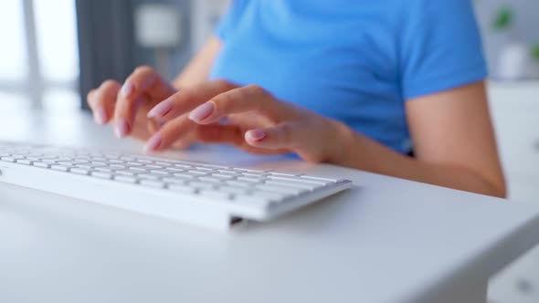 Female Hands Typing on a Computer Keyboard. Concept of Remote Work.