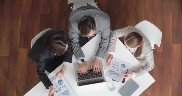 Business Team Analyzing Statistics alt