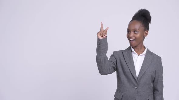 Young Happy African Businesswoman Thinking and Pointing Up