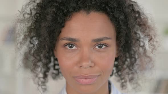 Close Up of Serious African Woman Looking at Camera