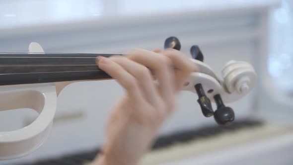 Close Up Hands of Unrecognizable Woman Performing Classic Music on Violin. Girl Is Practicing