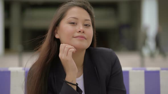 Beautiful Young Woman Smiling at Camera Outdoor