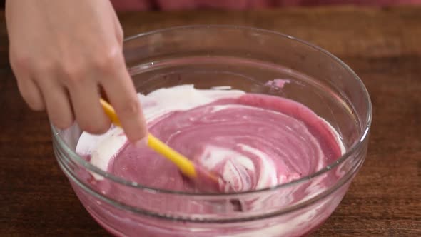 Pastry Chef Mixing a Berry Mousse for Cake.