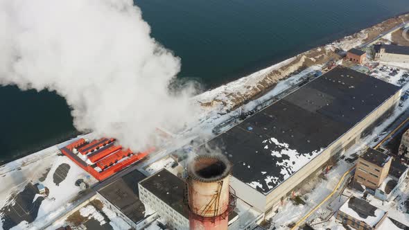 Aerial Video on the Chimney of an Power Plant From Which White Smoke Comes Out