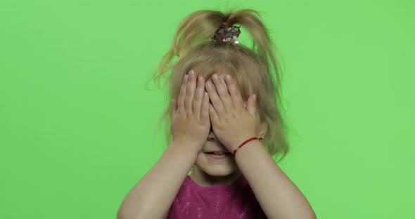 Child Portrait in Purple Dress. Hides Her Face with Hands and Sculps. Chroma Key