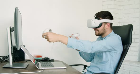 Business Man Who During the Coffee Break Relaxes in a Game with Virtual Achelers