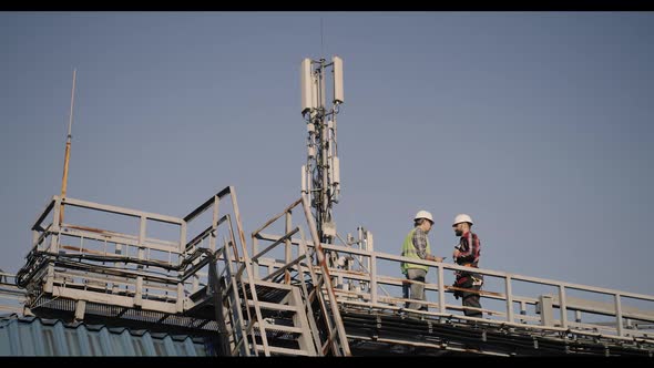 Engineers Working on a Cellular Tower