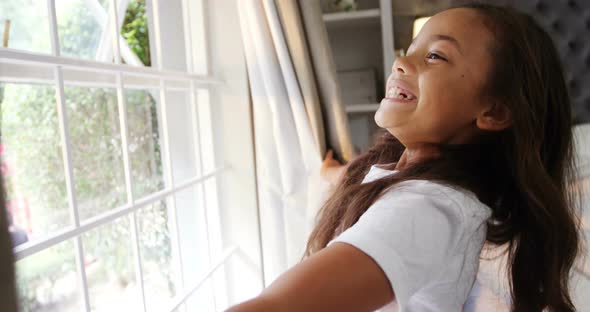 Girl opening window curtain after wake up in bedroom 4k