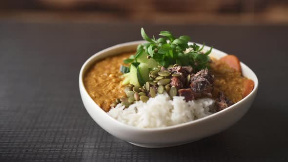 Closeup of Freshly Prepared Curry Rice Bowl on the Table