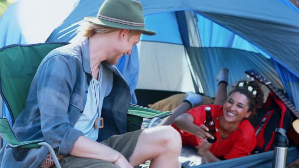 Couple toasting beer in the tent 4k