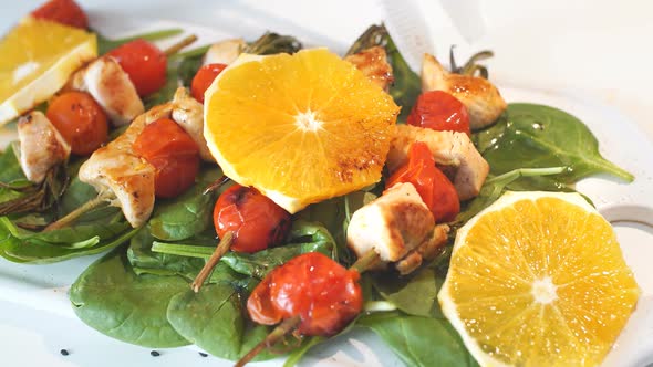 Close Up of Chicken Kebabs Served with Tomato Cherry and Rosemary on Frying Pan