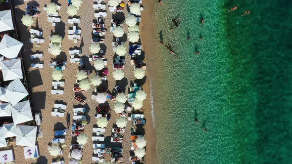 Mediterranean sea. Aerial view on beach and umbrellas. Vacation and adventure.