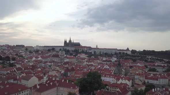 Drone shot of Prague with St. Vitus Cathedral in the distance