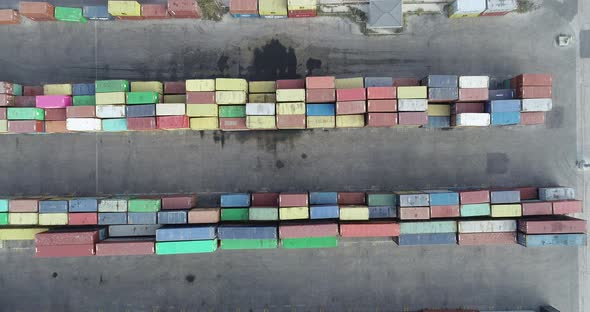 4K top down view of port container terminal. Industrial cargo harbor