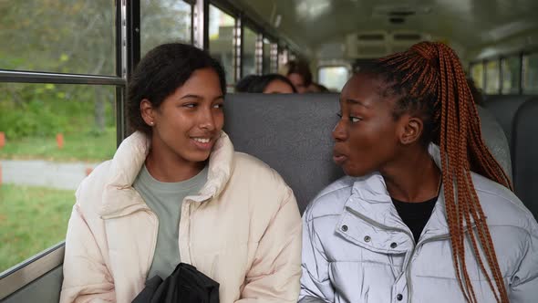 Friendly Multiracial Schoolgirls Riding School Bus