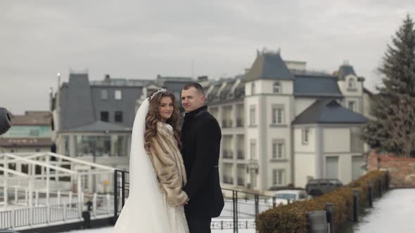 Newlyweds. Caucasian Groom with Bride Stay Together. Wedding Couple. Happy